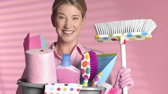Spring cleaning; woman with cleaning kit